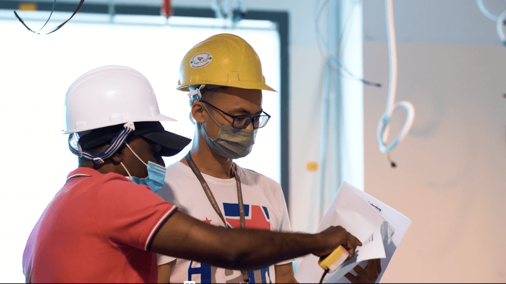 Construction engineers discuss renovation plans for Singapore Pools (Private) Limited (SPPL).